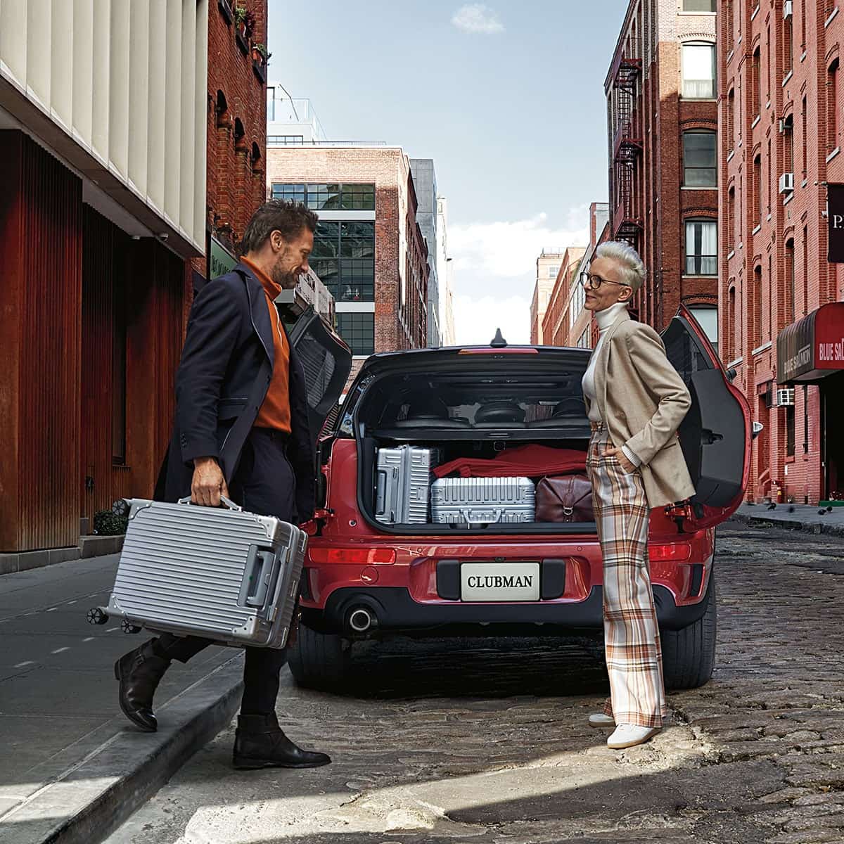 Two international business executives talking near their MINI