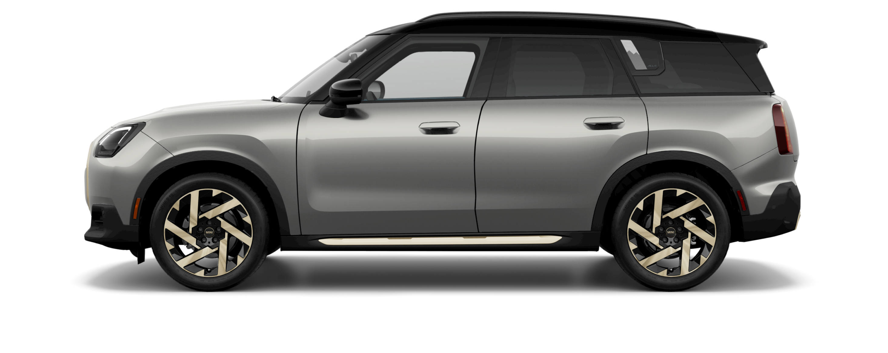 Side view of a 2025 MINI Countryman SE ALL4 in the Melting Silver III body color, facing left with its shadow underneath it