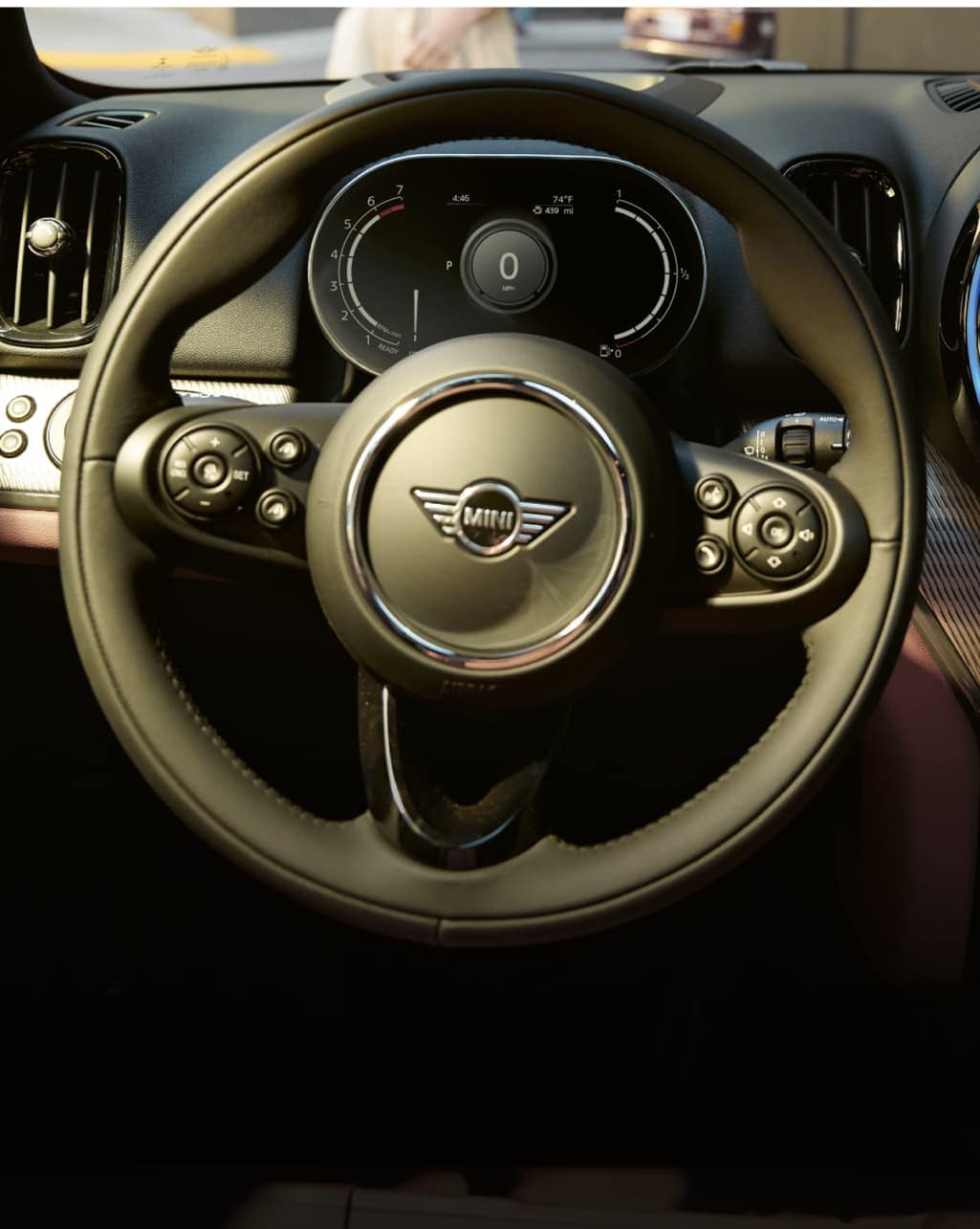 Closeup view of the multifunctional sport leather steering wheel in a MINI Countryman.