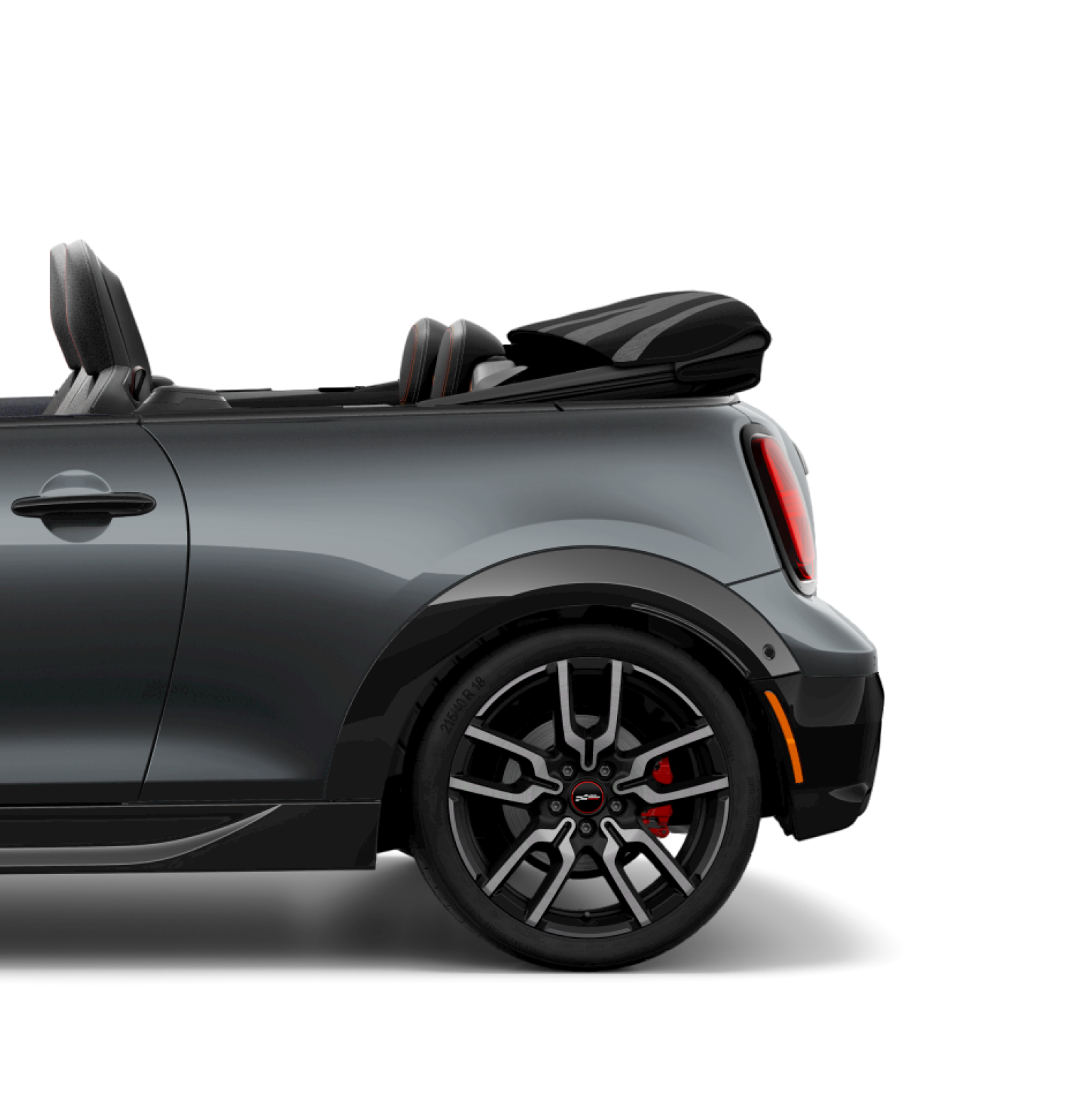 Side view of the rear of a JCW Convertible with the top down.