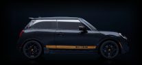 Side-view of the silhouette of a MINI covered in a dark lacquer.